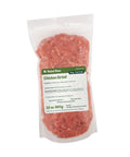 Package of Rebel Raw Chicken Grind pet food on a white background