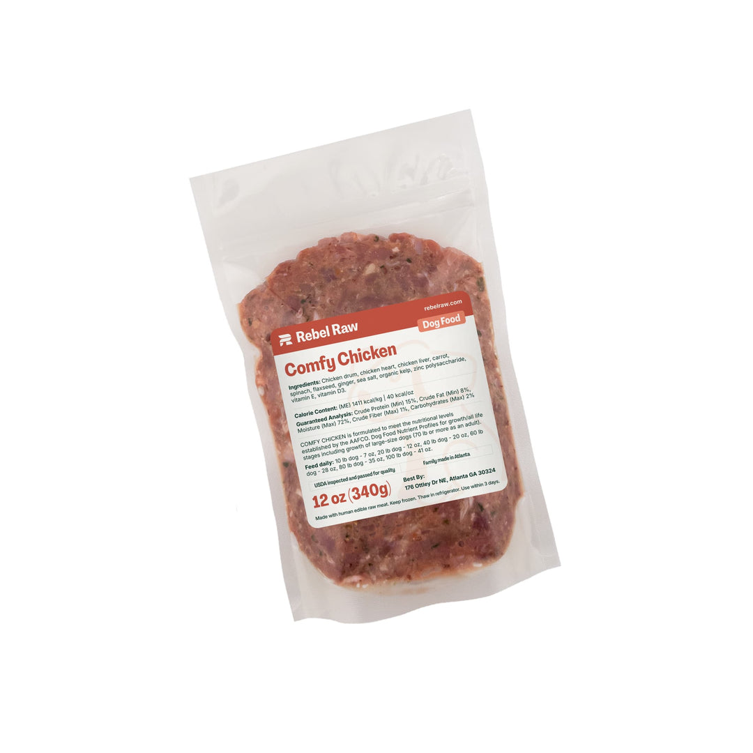 Package of Rebel Raw Comfy Chicken 12 oz dog food on a white background