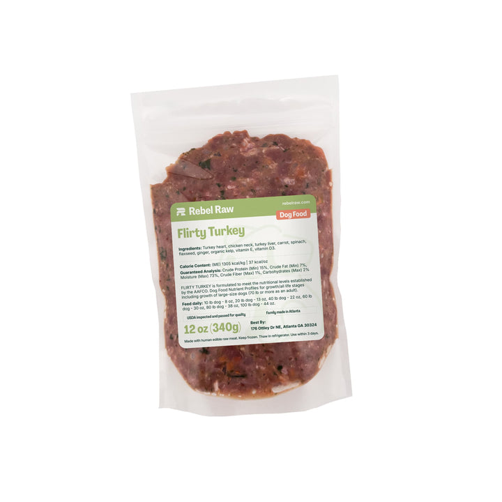 Package of Rebel Raw Flirty Turkey 12 oz dog food with a label on a white background