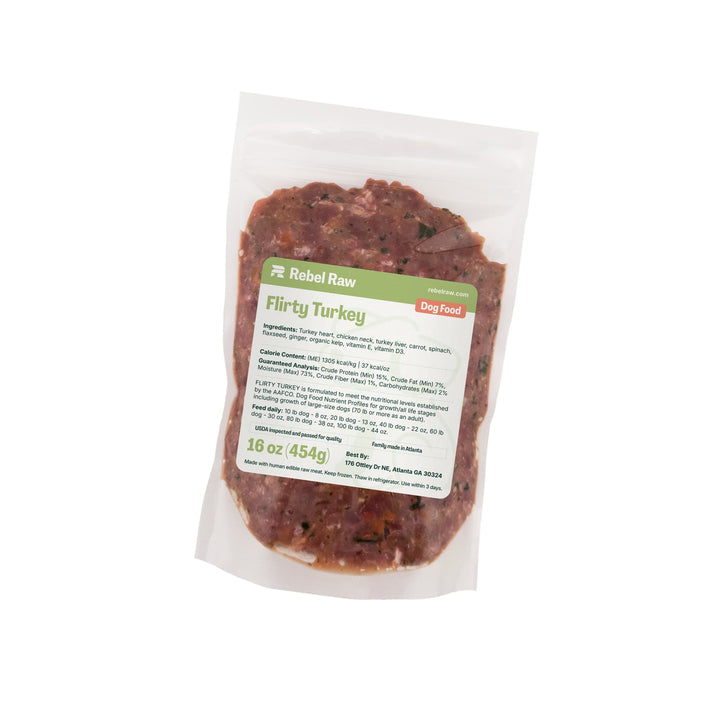 Package of Rebel Raw Flirty Turkey 16 oz dog food with a label on a white background