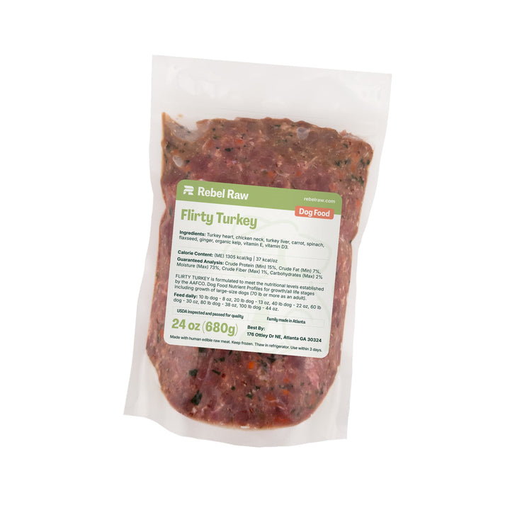 Package of Rebel Raw Flirty Turkey 24 oz dog food with a label on a white background