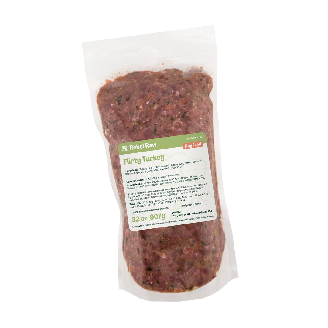 Package of Rebel Raw Flirty Turkey 32 oz dog food with a label on a white background