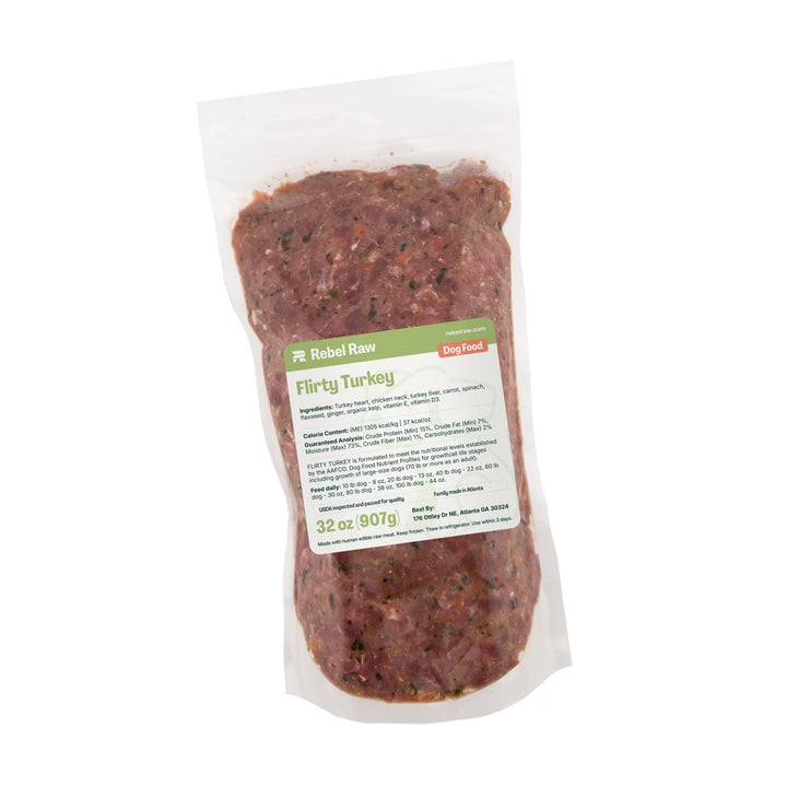 Package of Rebel Raw Flirty Turkey 32 oz dog food with a label on a white background