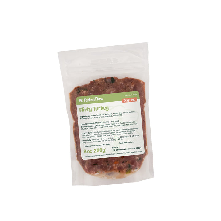 Package of Rebel Raw Flirty Turkey 8 oz dog food on a white background