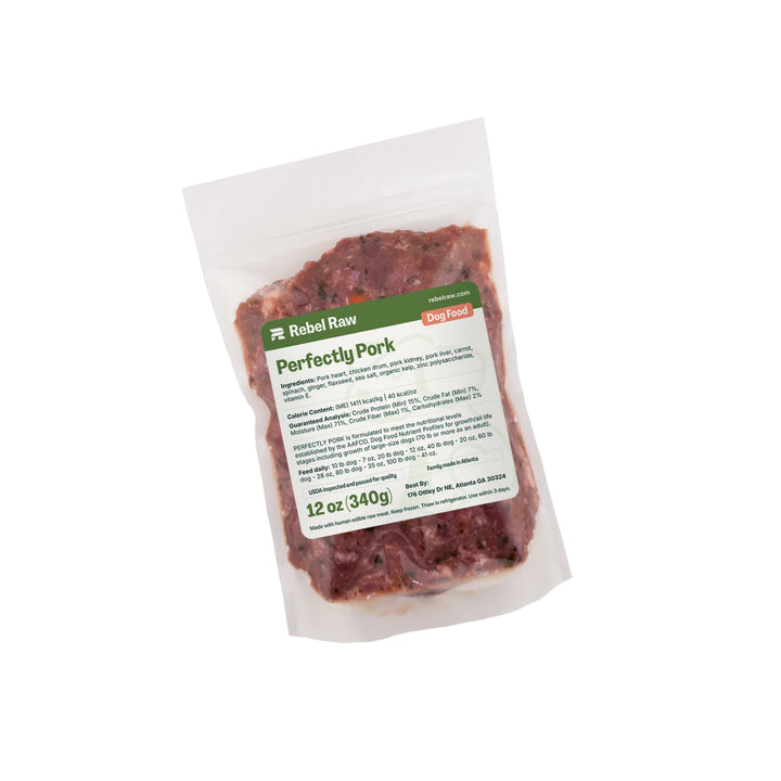 Package of Rebel Raw Perfectly Pork 12 oz dog food with a label on a white background