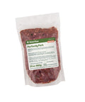 Package of Rebel Raw Perfectly Pork 24 oz dog food with a label on a white background