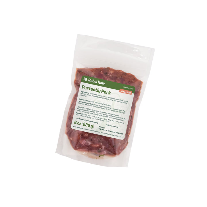 Package of Rebel Raw Perfectly Pork 8oz dog food with a label on a white background